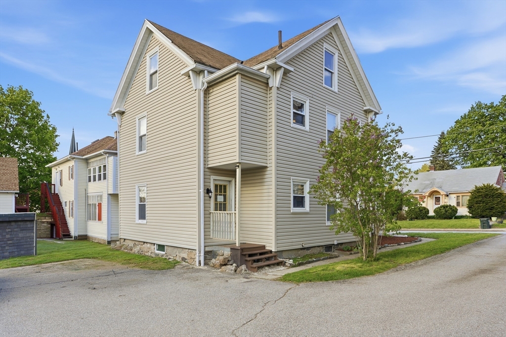 12 Whitcomb Street Webster, MA 01570 - Photo 37 of 40 a view of a house with a yard and garage