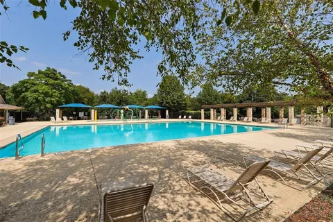a view of swimming pool with a yard