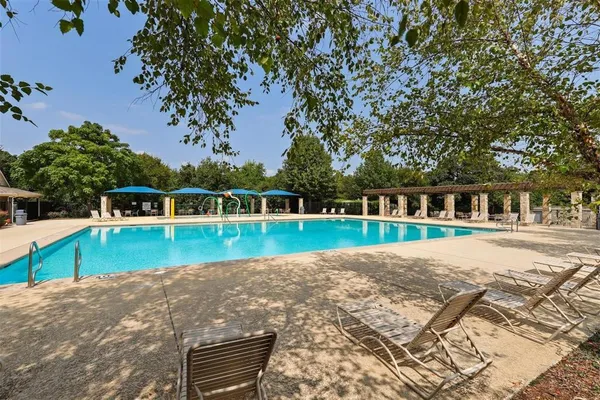 a view of swimming pool with a yard