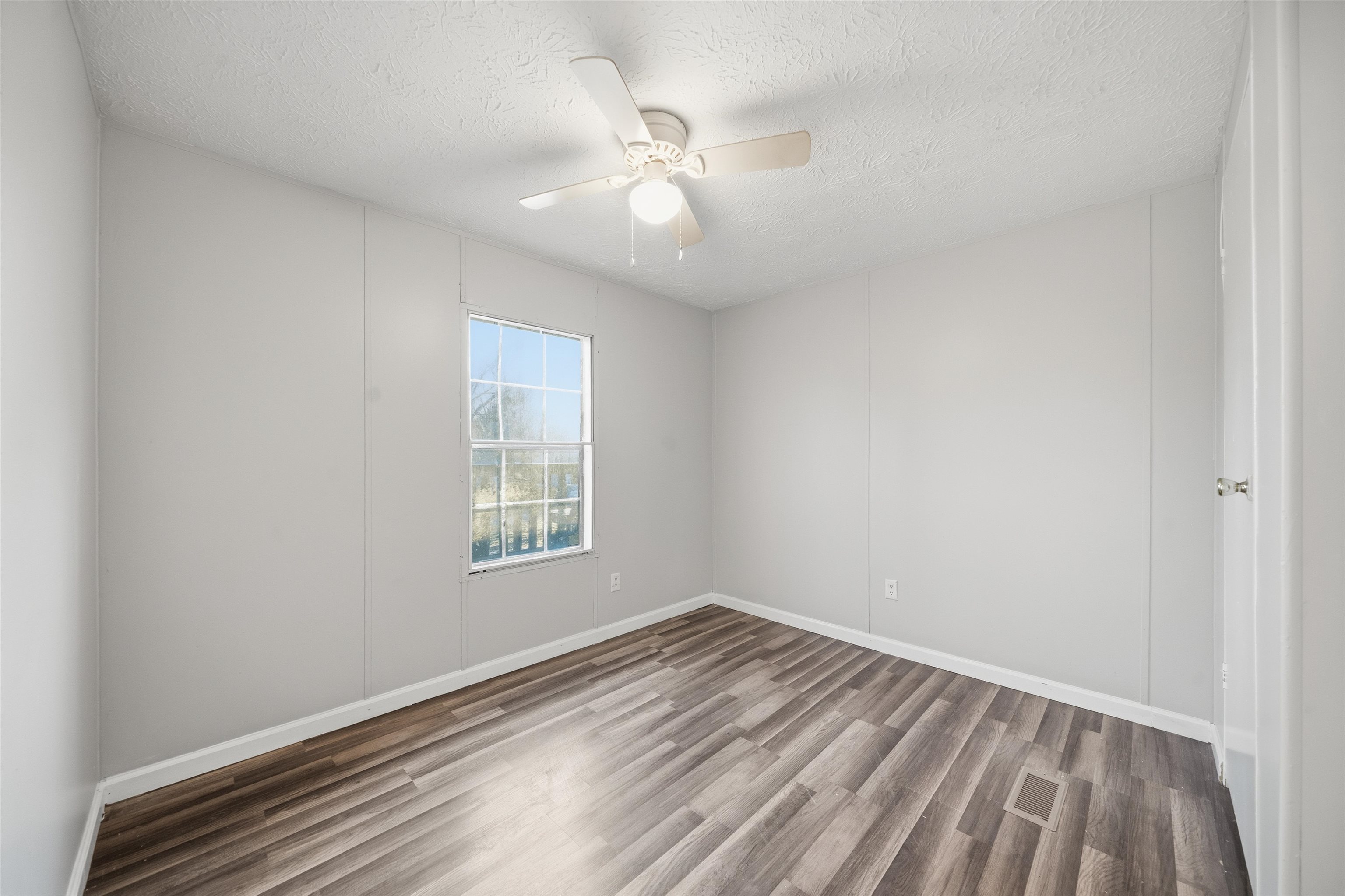 79 Stevens Road Mason, TN 38049 - Photo 13 of 21 wooden floor in an empty room with a window