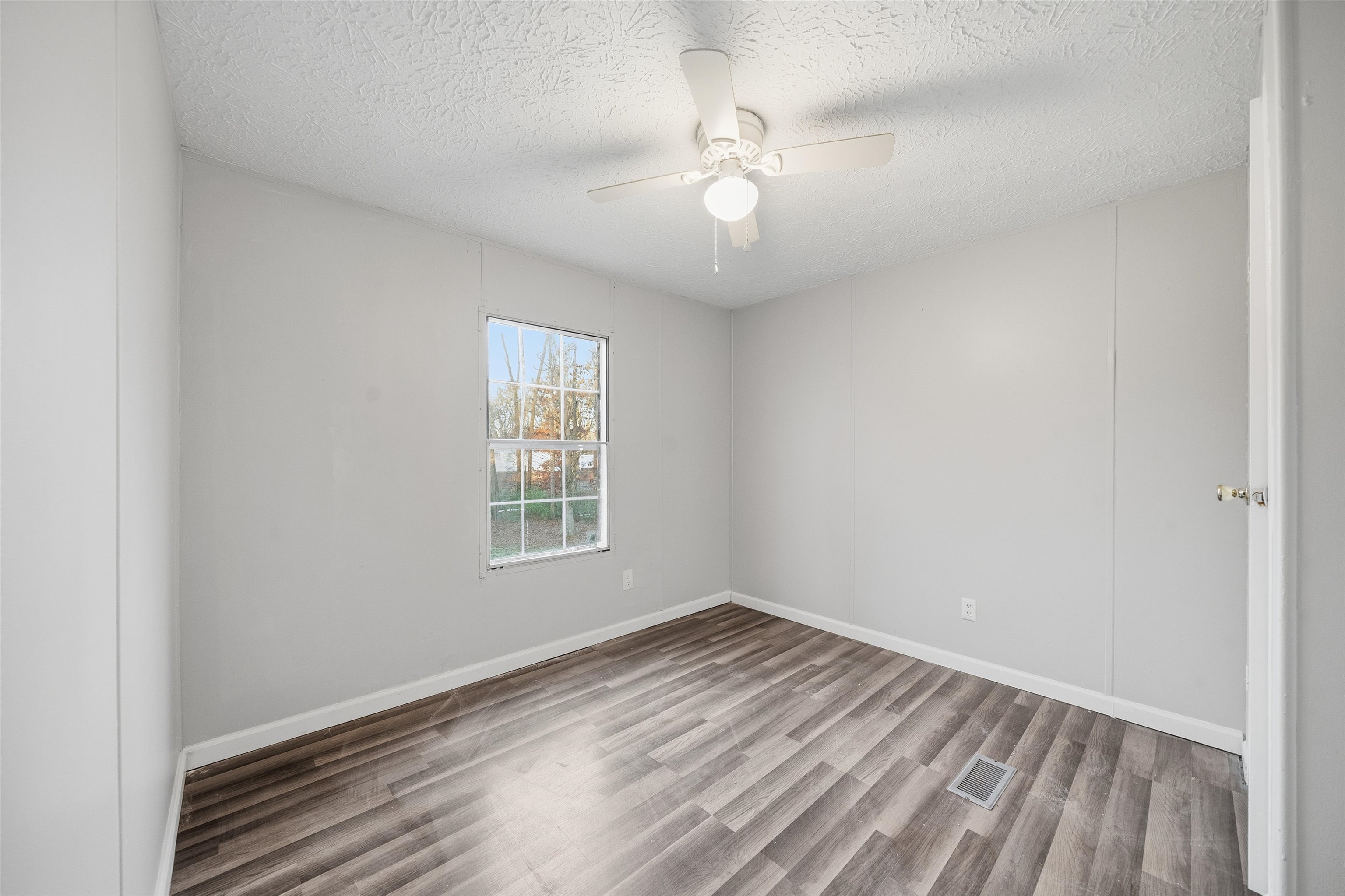 79 Stevens Road Mason, TN 38049 - Photo 15 of 21 wooden floor in an empty room with a window