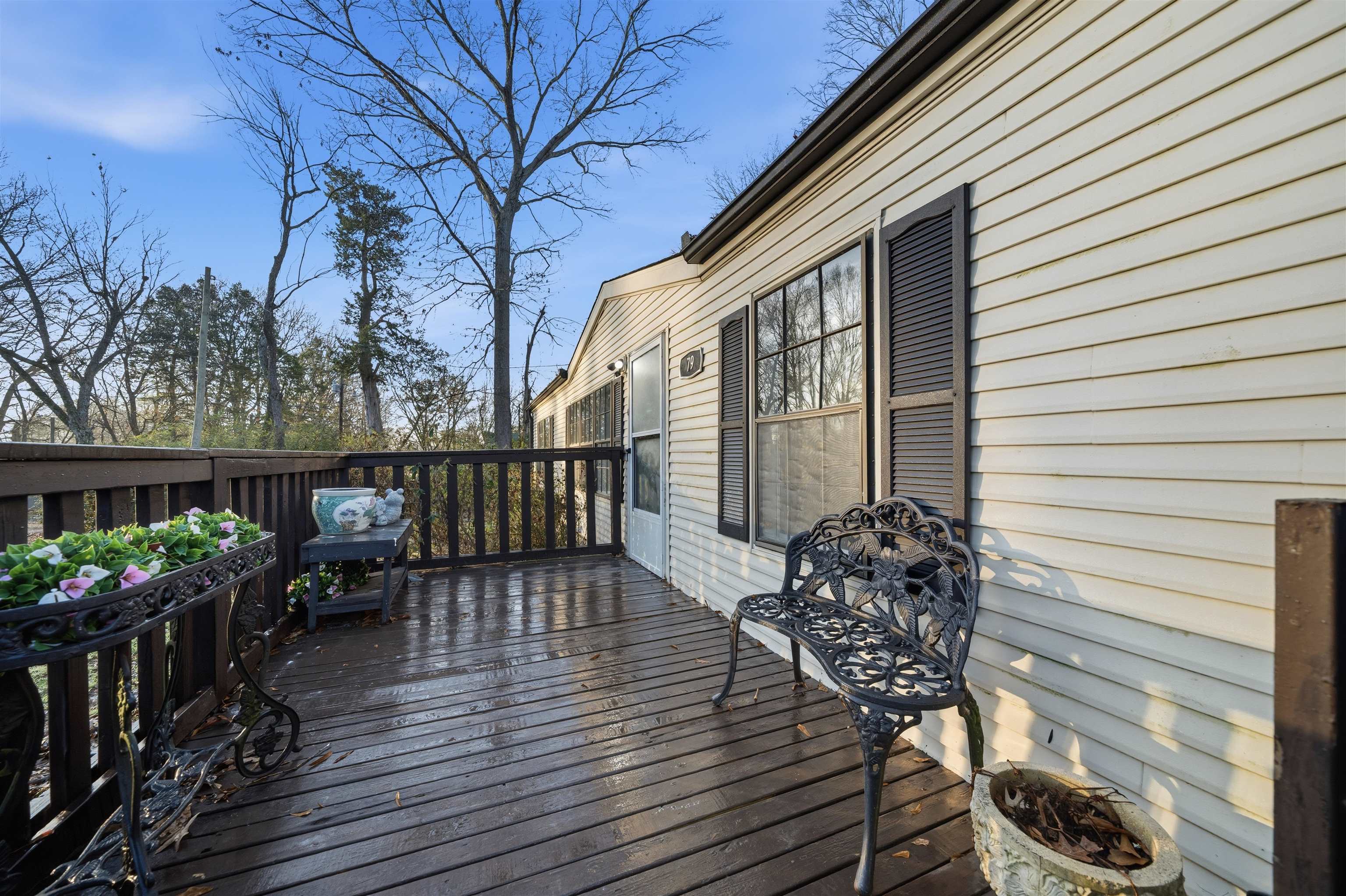79 Stevens Road Mason, TN 38049 - Photo 3 of 21 a balcony with wooden floor table and chairs