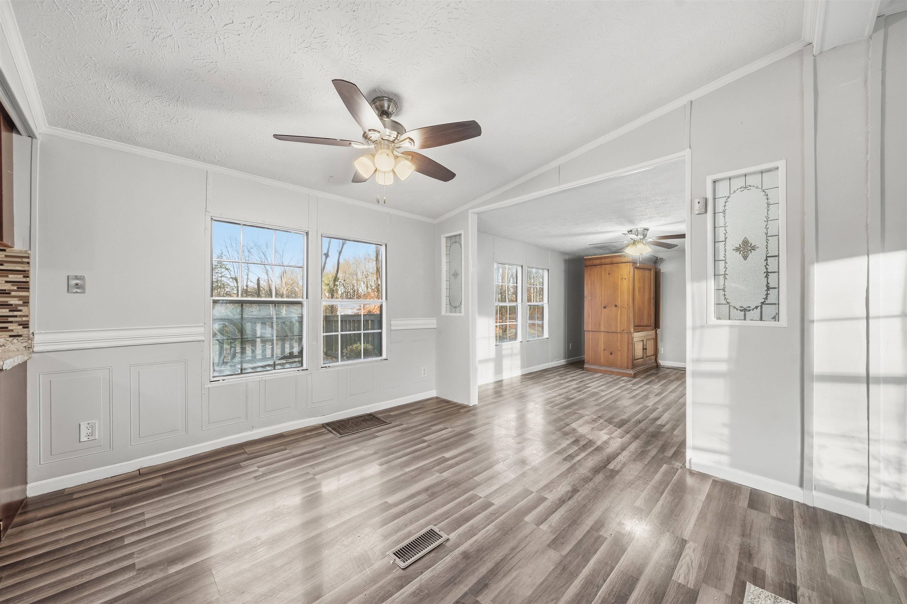79 Stevens Road Mason, TN 38049 - Photo 5 of 21 a view of empty room with wooden floor and fan