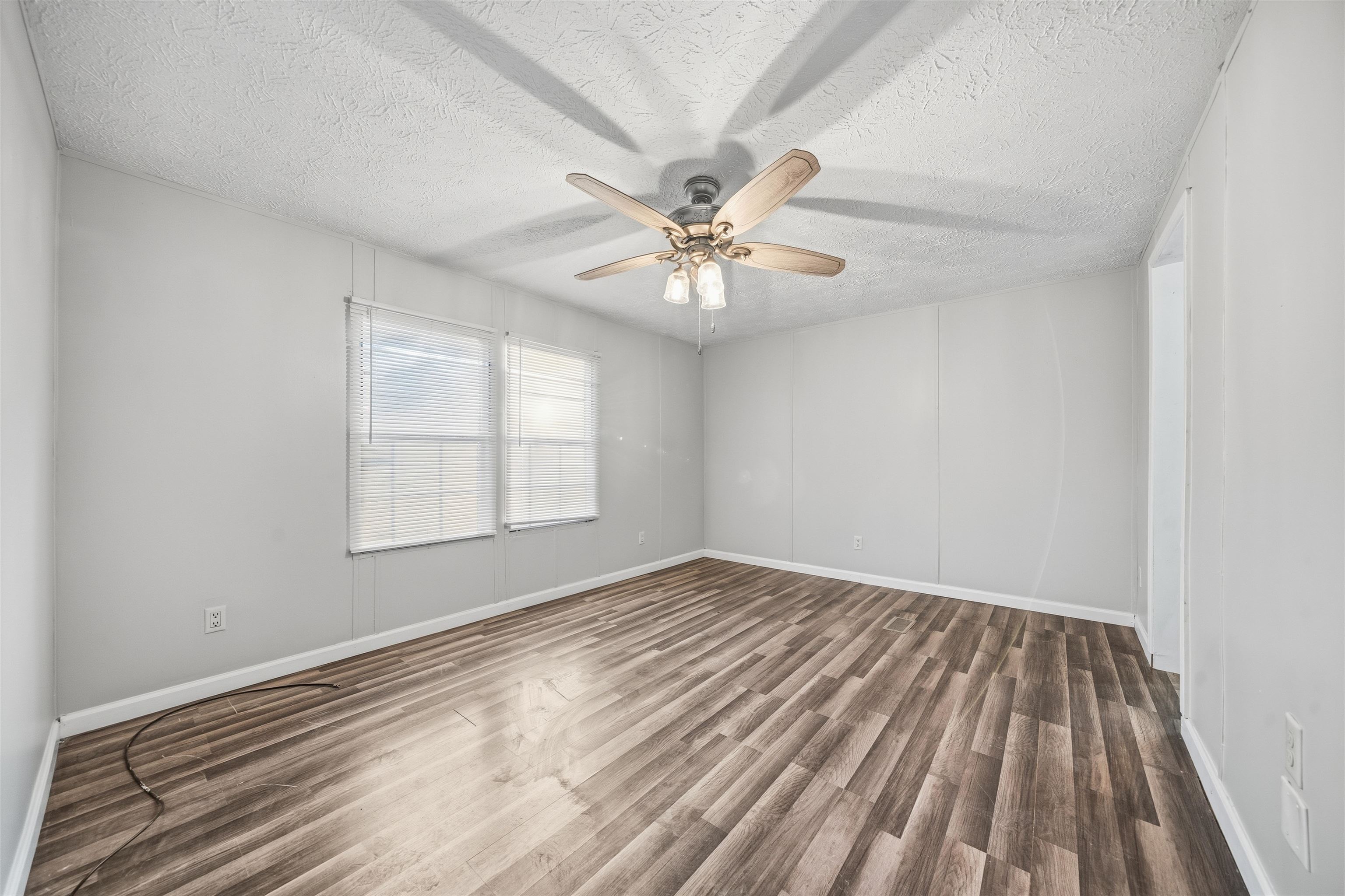 79 Stevens Road Mason, TN 38049 - Photo 10 of 21 wooden floor in an empty room with a window