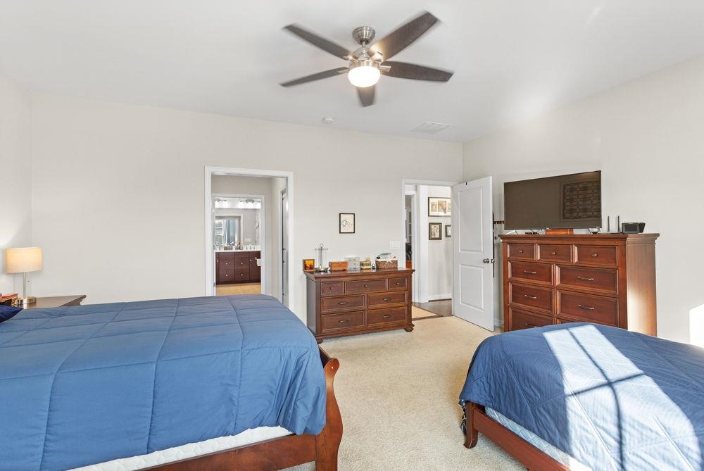 3060 Rutlege Road Harrisonburg, VA 22801 - Photo 11 of 37 a spacious bedroom with a bed and a flat screen tv