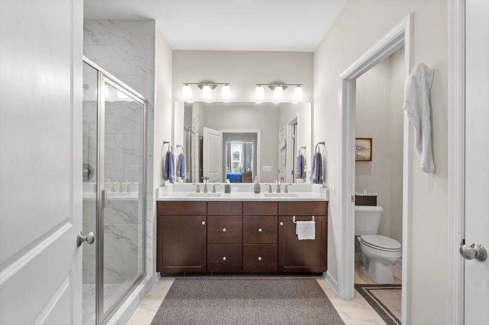 3060 Rutlege Road Harrisonburg, VA 22801 - Photo 15 of 37 a bathroom with a double vanity sink toilet and shower