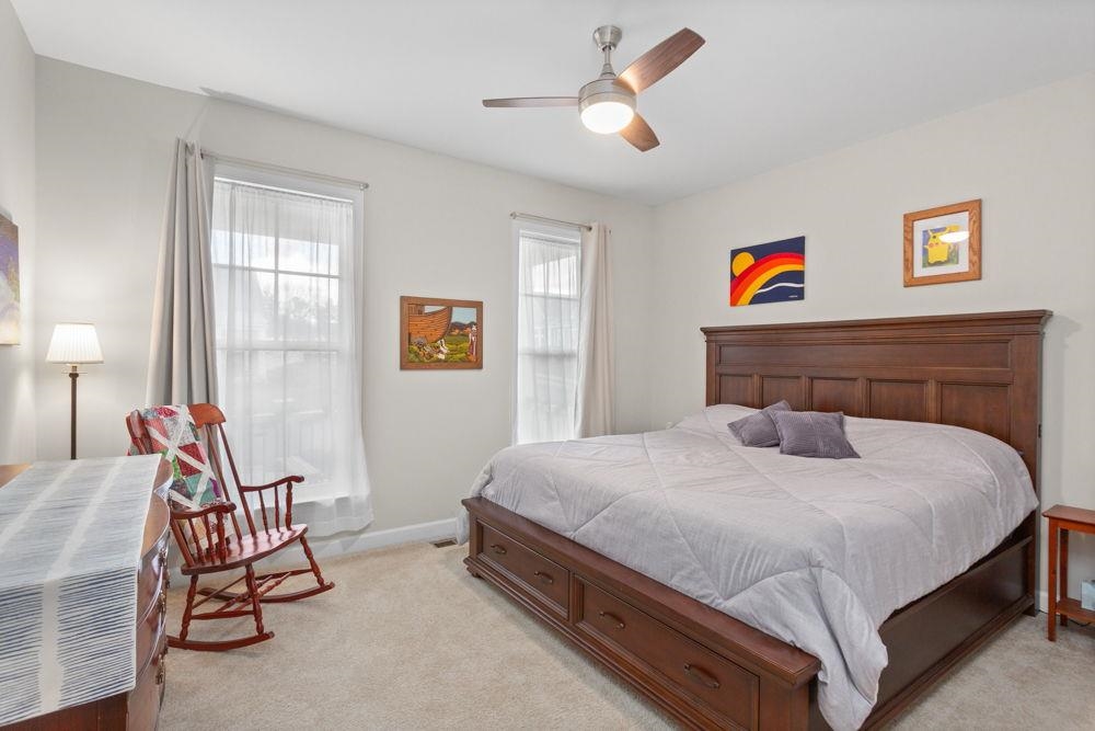 3060 Rutlege Road Harrisonburg, VA 22801 - Photo 16 of 37 a bedroom with a bed and a chandelier