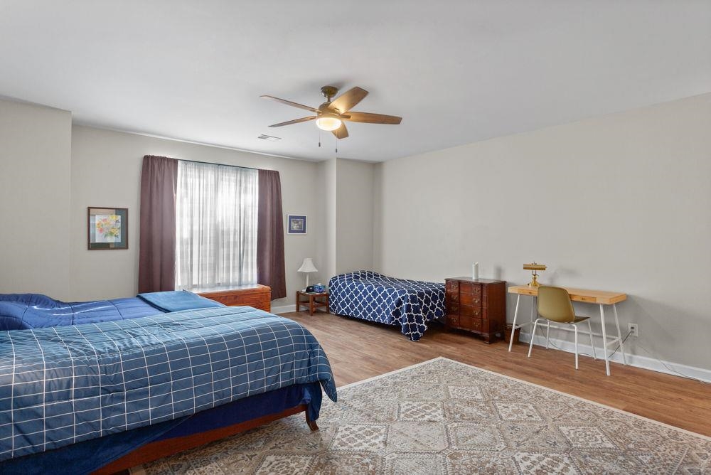 3060 Rutlege Road Harrisonburg, VA 22801 - Photo 24 of 37 a bedroom with a bed a dresser and chair