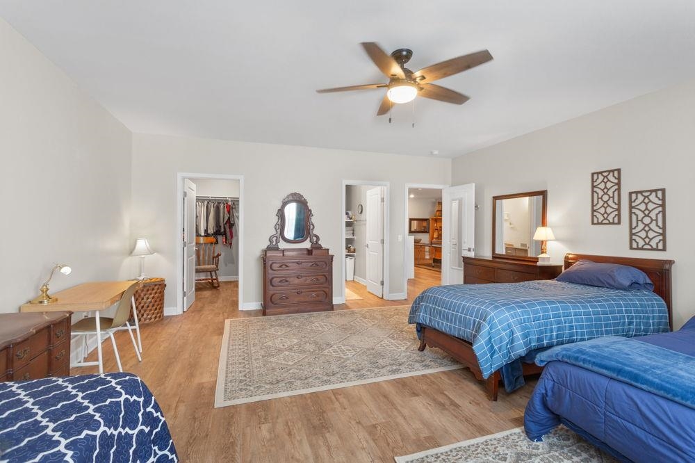 3060 Rutlege Road Harrisonburg, VA 22801 - Photo 25 of 37 a bedroom with a large bed a chandelier and dresser