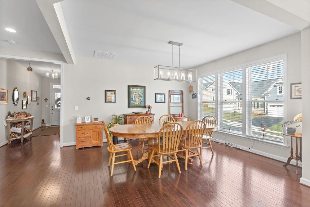 3060 Rutlege Road Harrisonburg, VA 22801 - Photo 3 of 37 a view of a dining room with furniture wooden floor and chandelier
