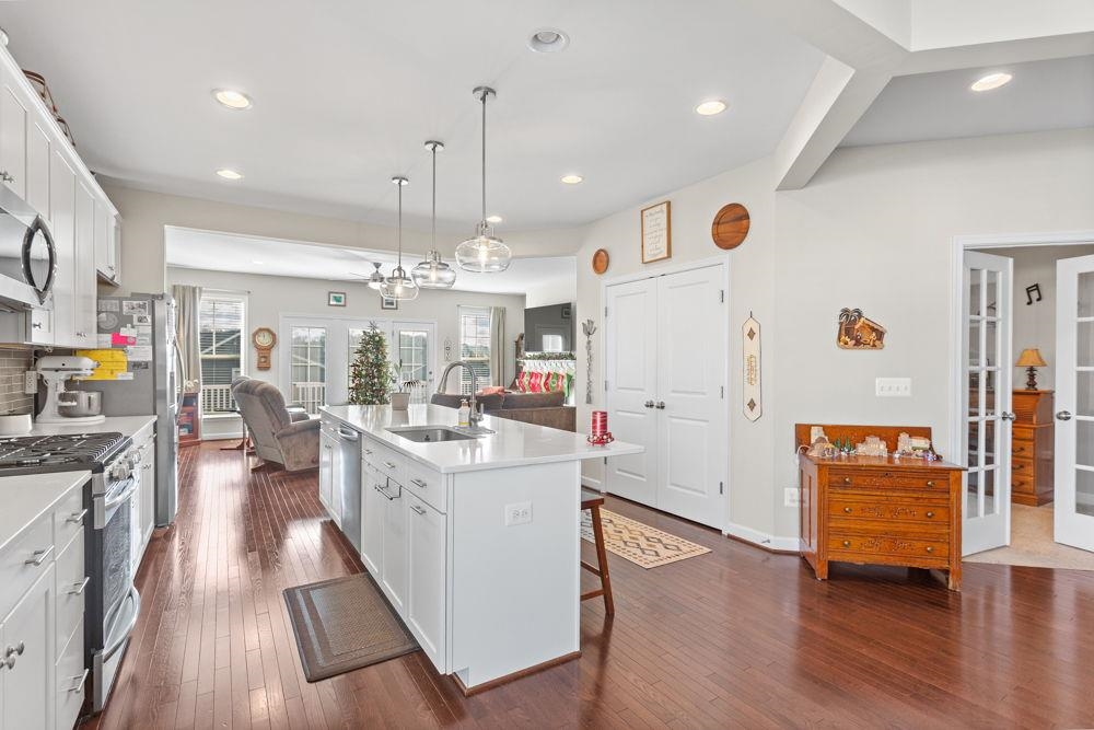 3060 Rutlege Road Harrisonburg, VA 22801 - Photo 4 of 37 a large white kitchen with lots of counter space wooden floor and appliances