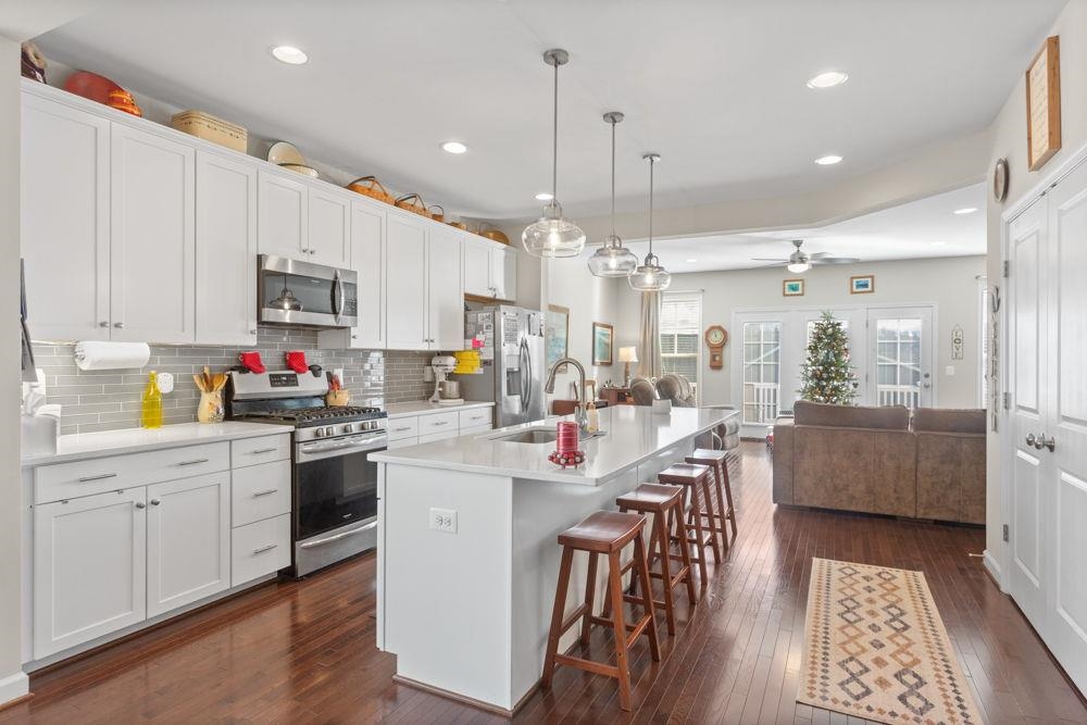 3060 Rutlege Road Harrisonburg, VA 22801 - Photo 5 of 37 a kitchen with stainless steel appliances kitchen island granite countertop a sink and cabinets