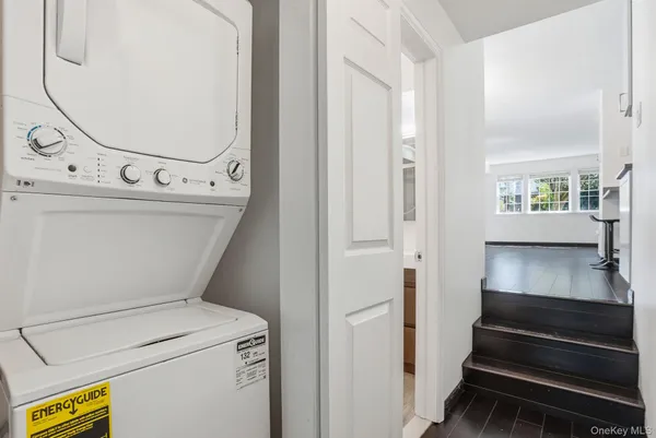 a view of washer and dryer with wooden floor