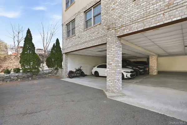 a view of a car park in front of house