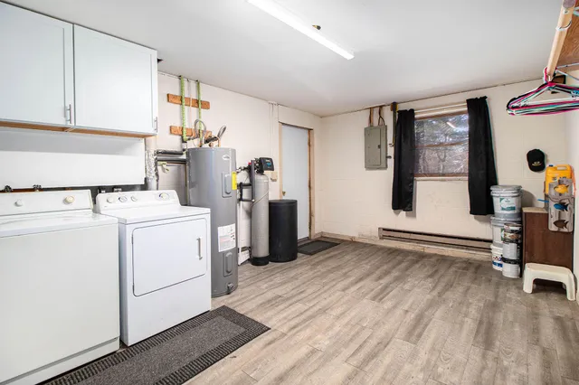 a view of storage and utility room with washer and dryer