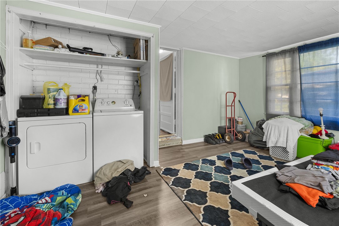 303 South Elm Street Pendleton, SC 29670 - Photo 15 of 16 This dedicated laundry space combines convenience with practical, durable flooring.