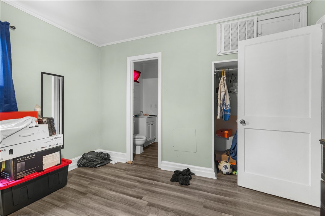 303 South Elm Street Pendleton, SC 29670 - Photo 10 of 16 This cozy bedroom features durable vinyl plank flooring and convenient closet storage.