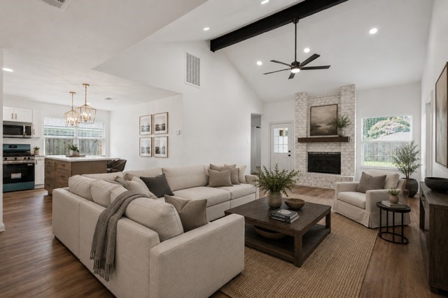 5326 Findlay Drive Pasadena, TX 77505 - Photo 8 of 50 Virtually Staged /Spacious living room with vaulted ceilings, abundant natural light, and a stunning brick fireplace.