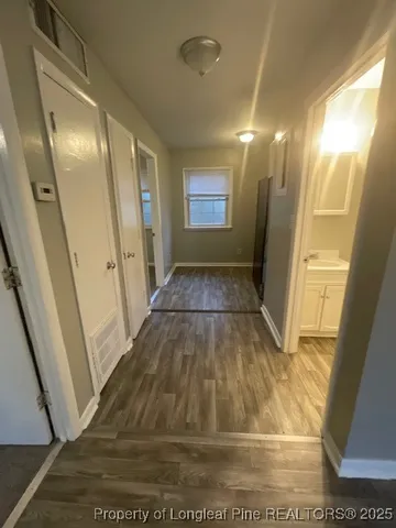 a view of gallery with wooden floor