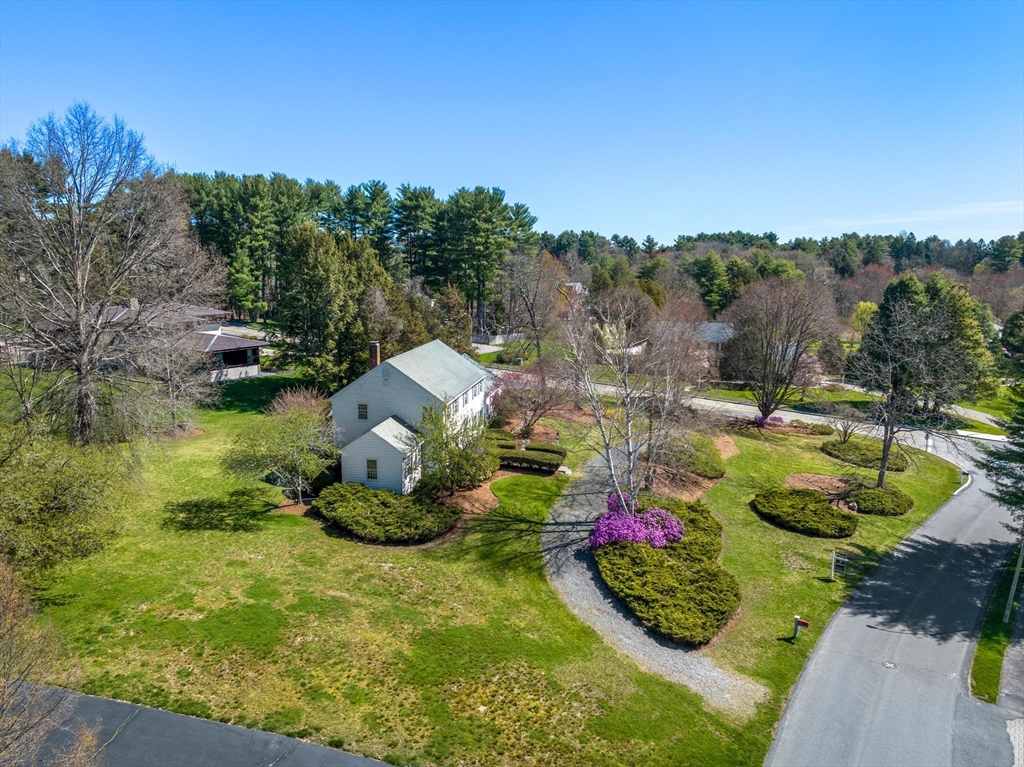 169 Fox Hill Road Needham, MA 02492 - Photo 22 of 22 a view of a swimming pool with a garden and trees