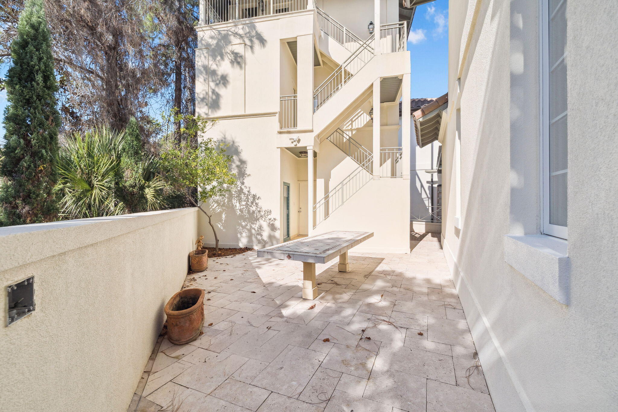 152 White Cliffs Boulevard Santa Rosa Beach, FL 32459 - Photo 21 of 82 a view of a patio with a table and chairs and wooden floor