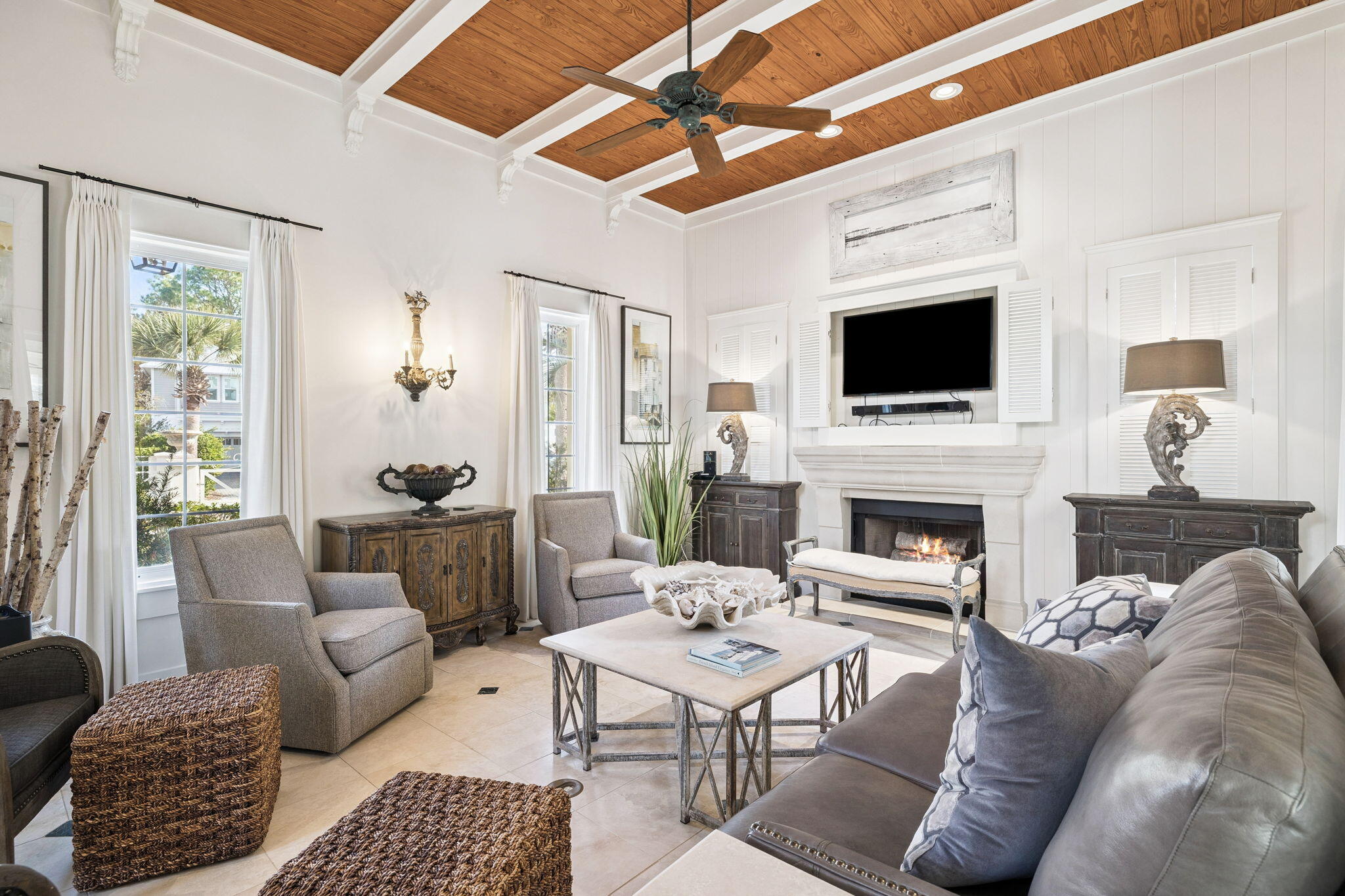 152 White Cliffs Boulevard Santa Rosa Beach, FL 32459 - Photo 30 of 82 a living room with furniture a fireplace and a flat screen tv