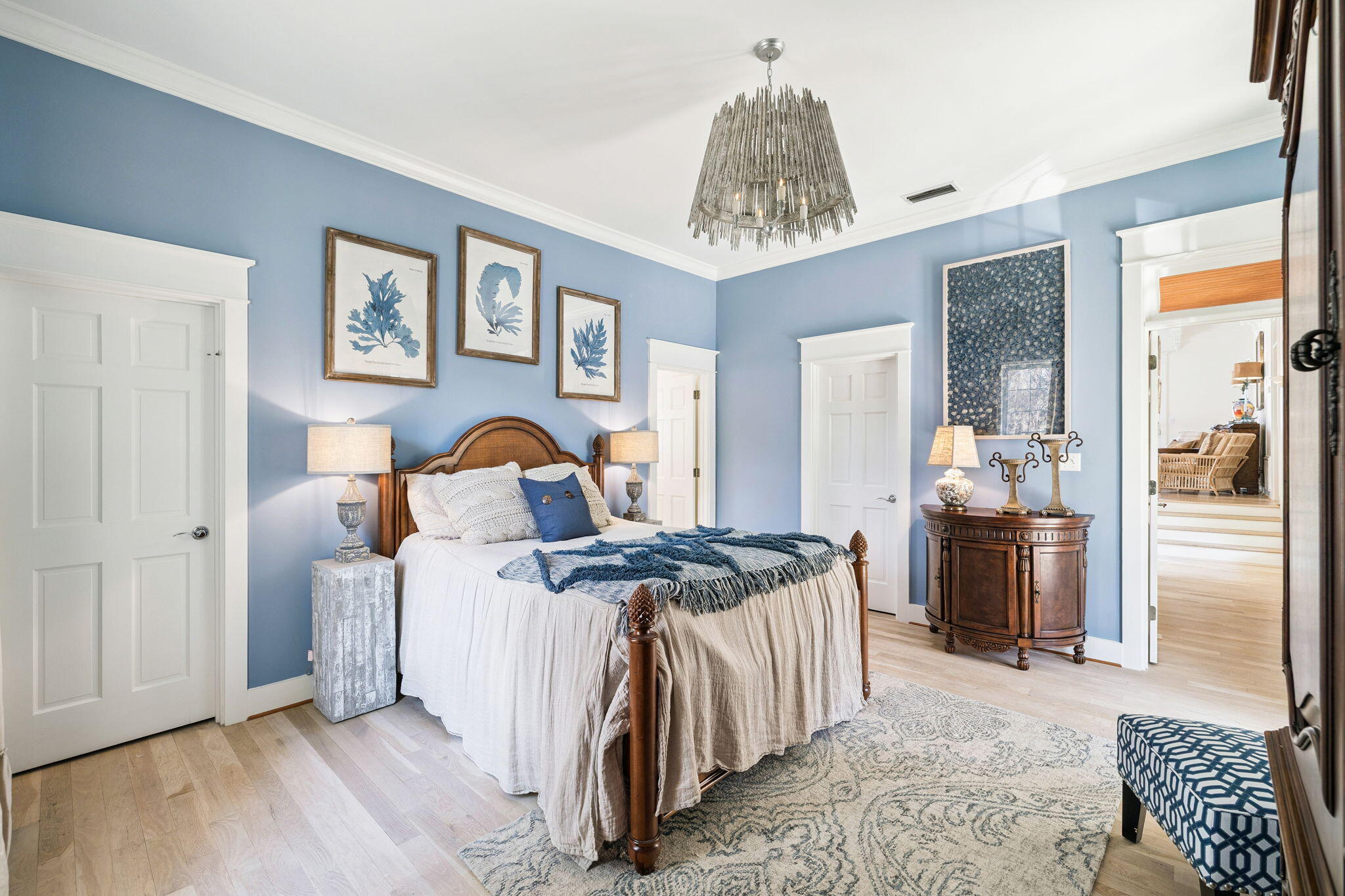 152 White Cliffs Boulevard Santa Rosa Beach, FL 32459 - Photo 55 of 82 a bedroom with a bed and a chandelier