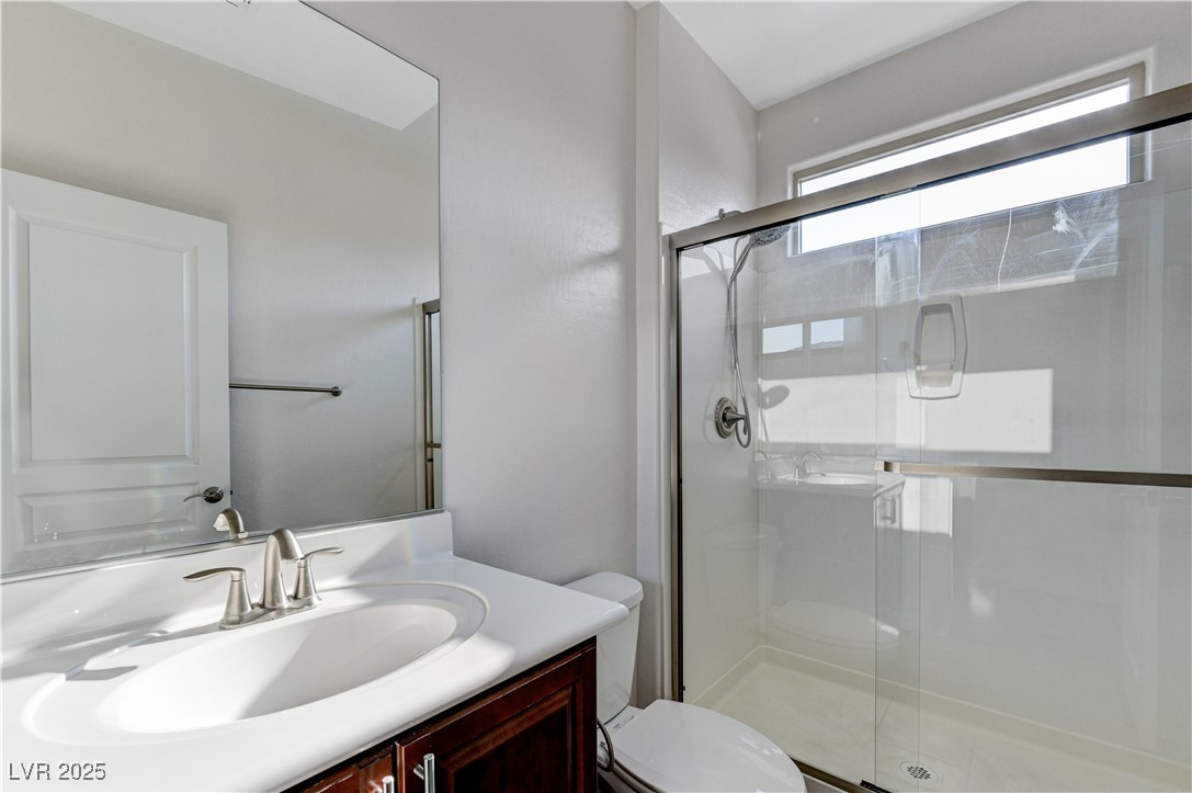 6946 Motley Road Las Vegas, NV 89178 - Photo 23 of 31 Full bath featuring vanity and a stall shower