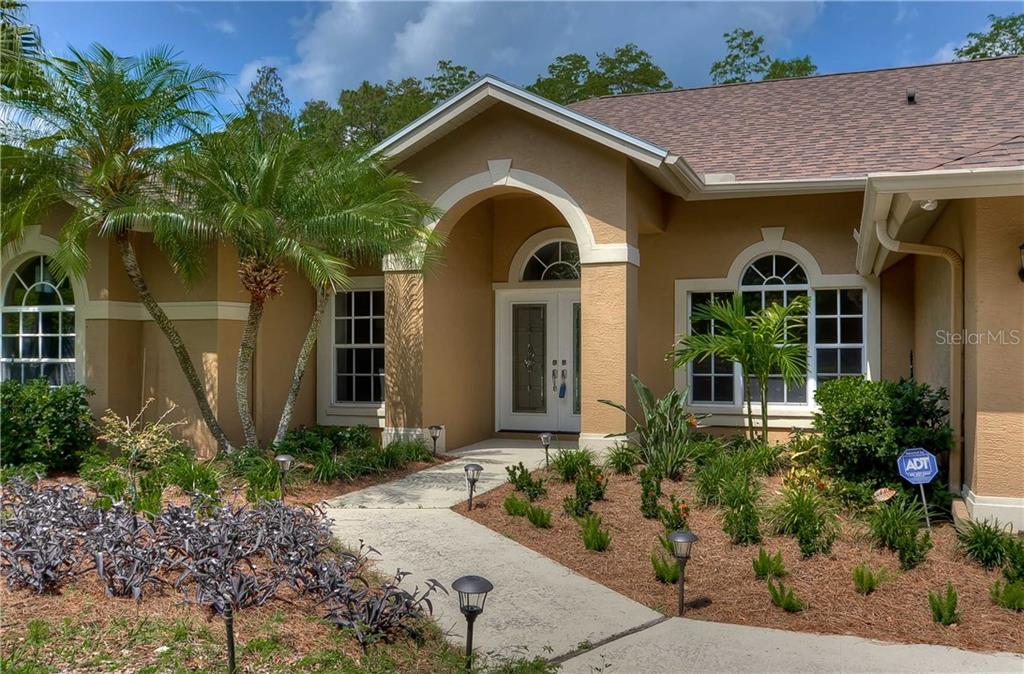19136 Rogers Road Odessa, FL 33556 - Photo 1 of 1 Welcoming entryway with new roof and exterior paint