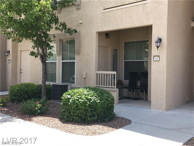 10550 West Alexander Road, Unit 1125 Las Vegas, NV 89129 - Photo 1 of 1 A welcoming front entrance with well-maintained shrubs and a charming covered porch.