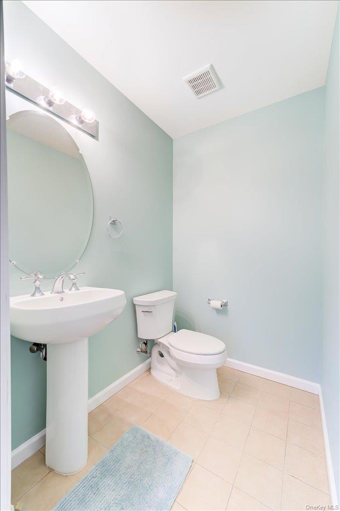 26 Halley Court Poughkeepsie, NY 12601 - Photo 15 of 47 a bathroom with a sink a toilet and mirror