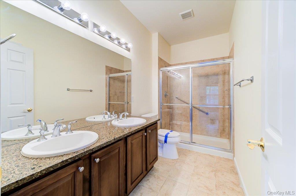 26 Halley Court Poughkeepsie, NY 12601 - Photo 20 of 47 a bathroom with a sink double vanity and a mirror