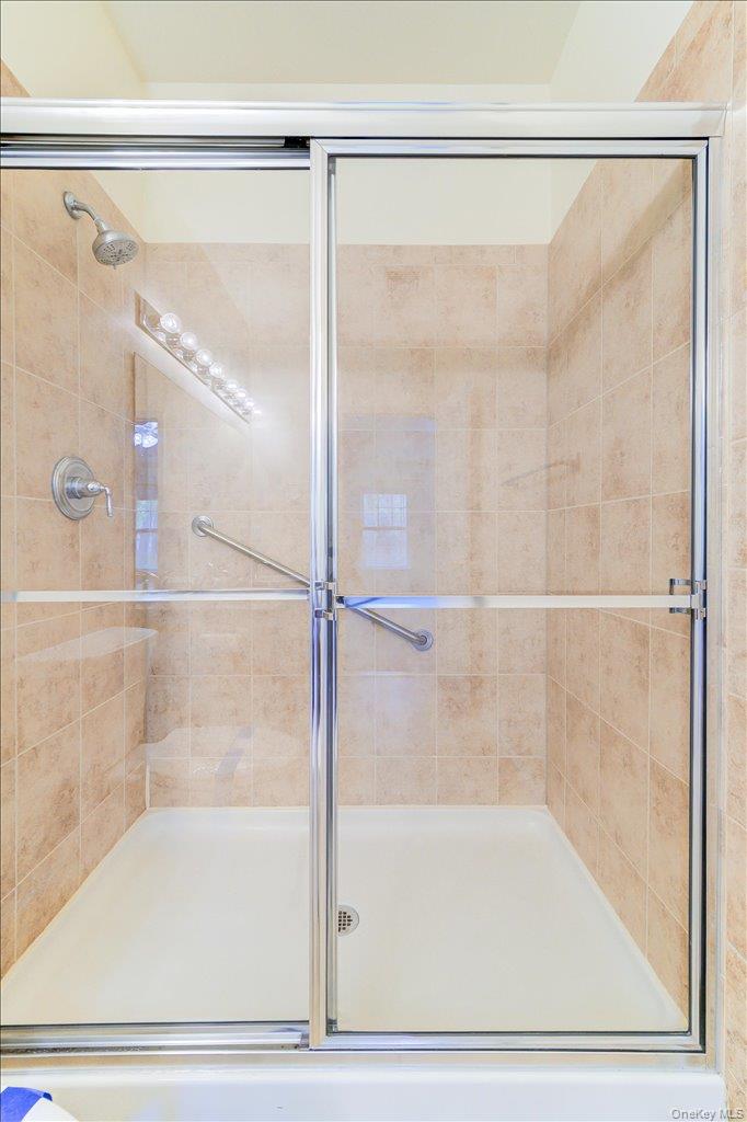 26 Halley Court Poughkeepsie, NY 12601 - Photo 21 of 47 a bathroom with a glass shower door