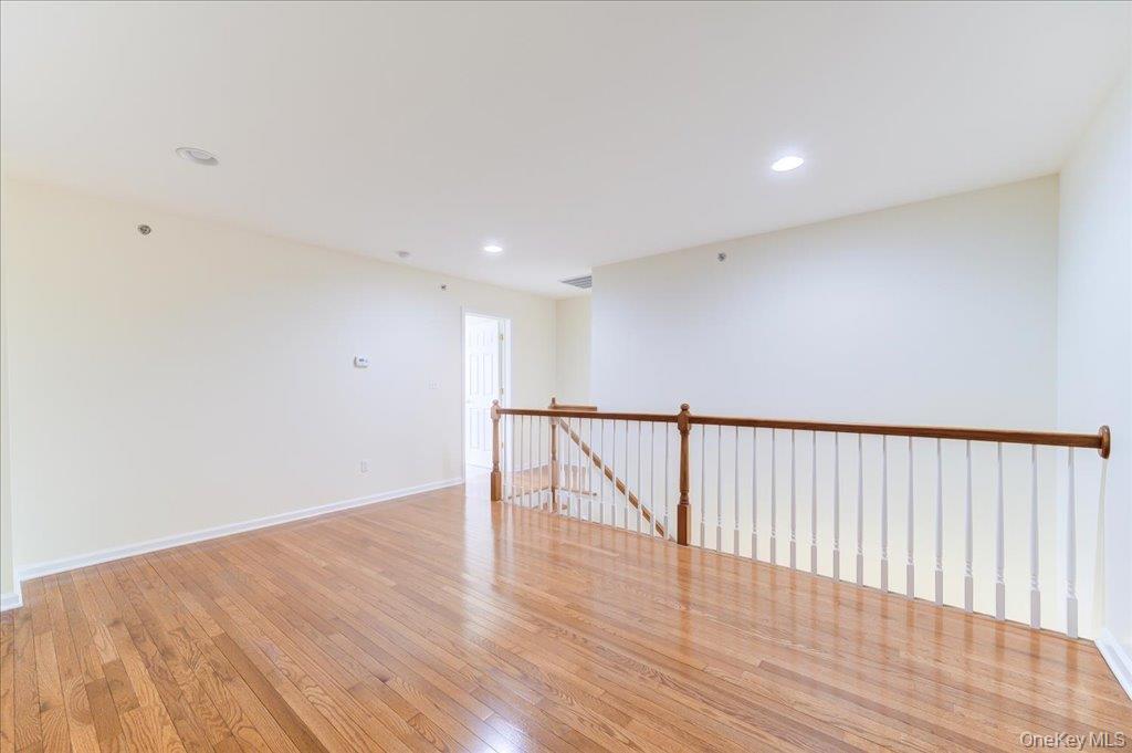 26 Halley Court Poughkeepsie, NY 12601 - Photo 24 of 47 a view of an empty room with wooden floor