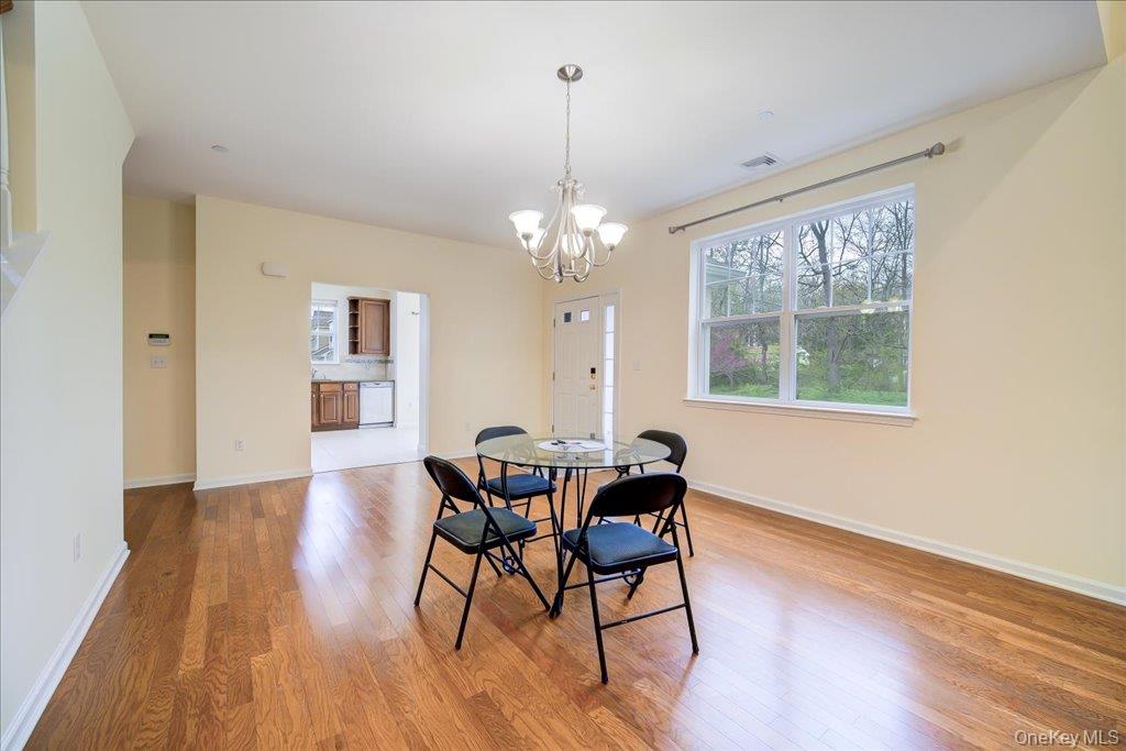 26 Halley Court Poughkeepsie, NY 12601 - Photo 6 of 47 a view of a dining room with furniture window and wooden floor