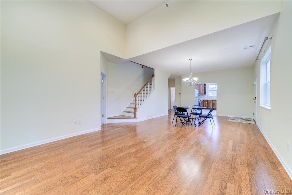 26 Halley Court Poughkeepsie, NY 12601 - Photo 7 of 47 a view of dining room with furniture and wooden floor