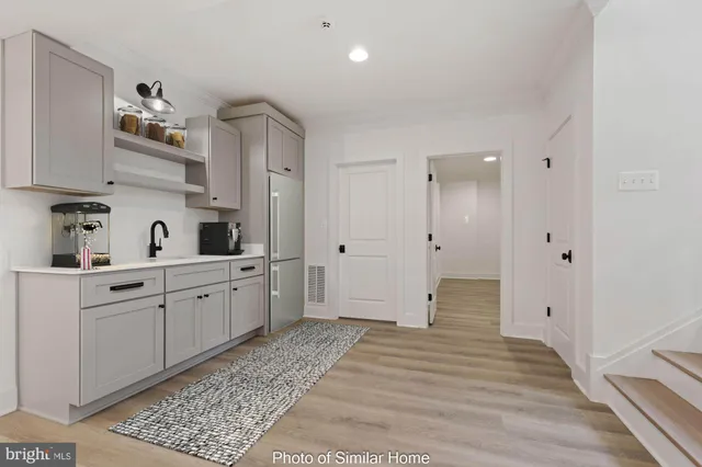 a spacious bathroom with double vanity mirrors and shower