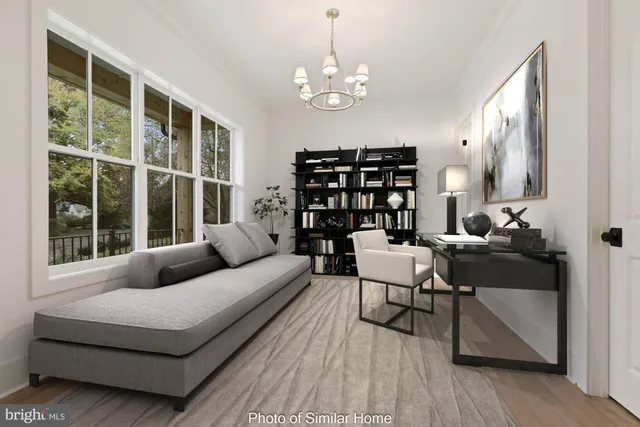 a living room with furniture a lamp and a large window