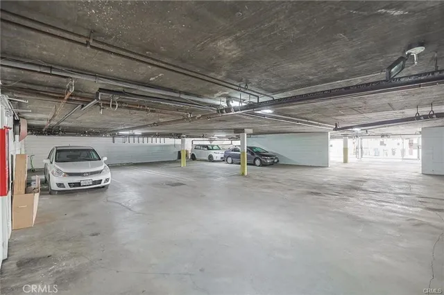 a view of parking garage with cars