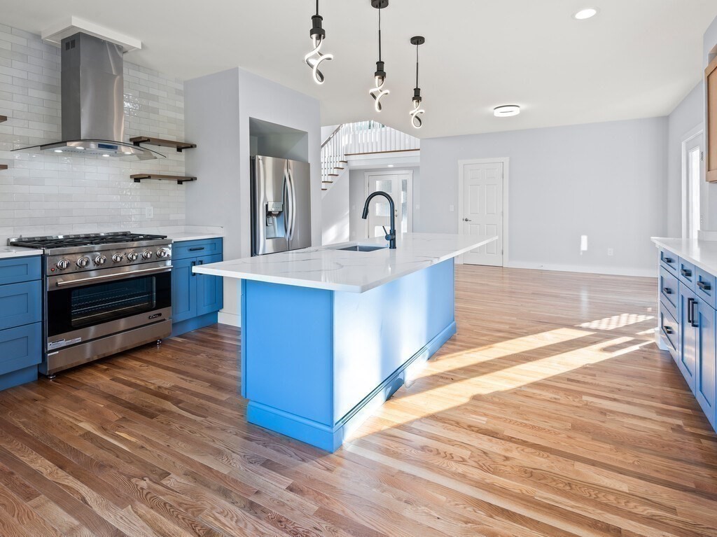 41 Westminster Street Worcester, MA 01605 - Photo 14 of 36 a large kitchen with stainless steel appliances granite countertop a stove and a sink with cabinets
