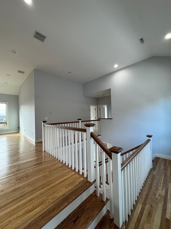 41 Westminster Street Worcester, MA 01605 - Photo 19 of 36 a view of a hallway with wooden floor and stairs