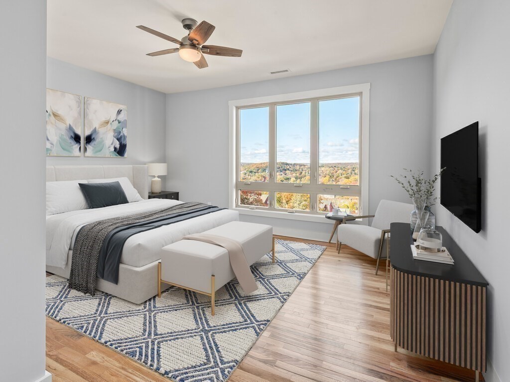 41 Westminster Street Worcester, MA 01605 - Photo 28 of 36 a bedroom with a bed and a flat screen tv