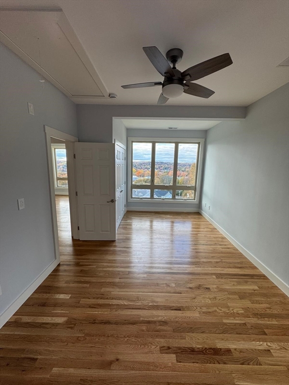 41 Westminster Street Worcester, MA 01605 - Photo 29 of 36 a view of an empty room with wooden floor and a window