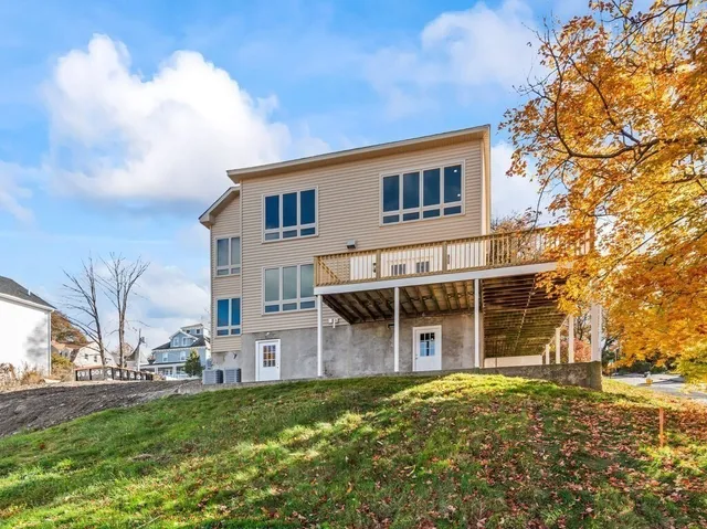 a view of a house with a yard and plants