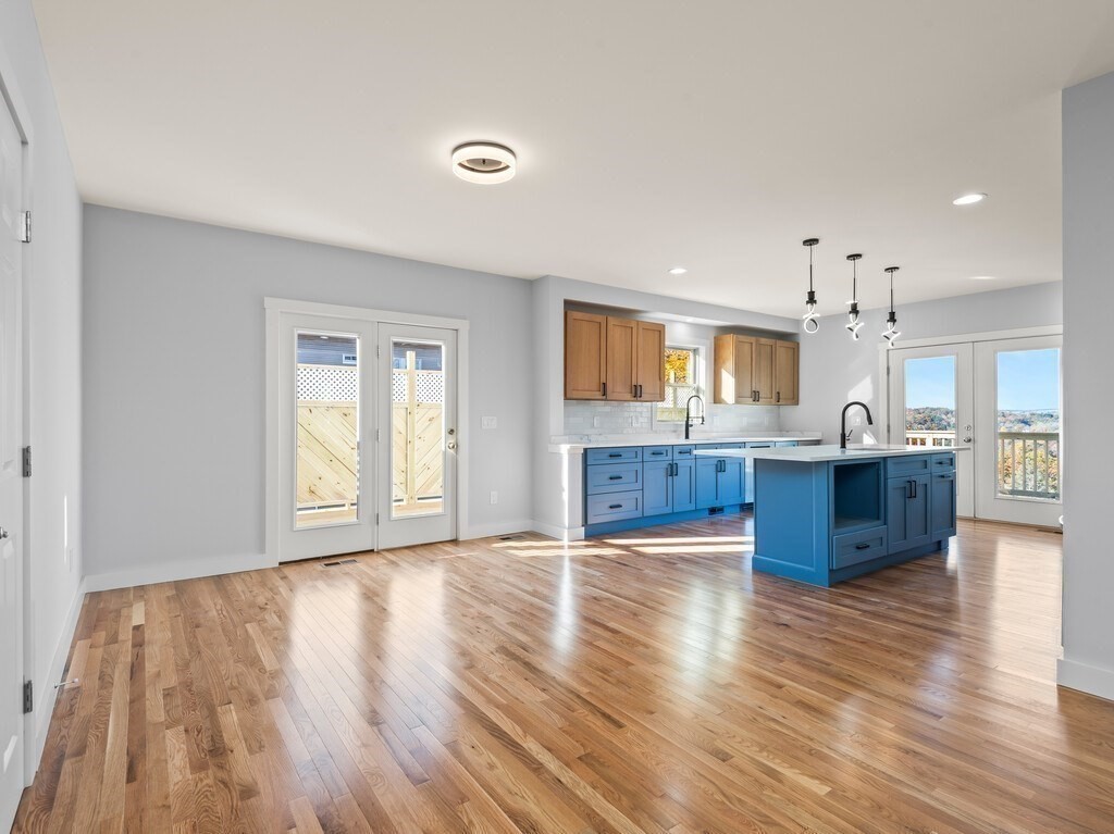 41 Westminster Street Worcester, MA 01605 - Photo 6 of 36 a view of kitchen and hall with wooden floor