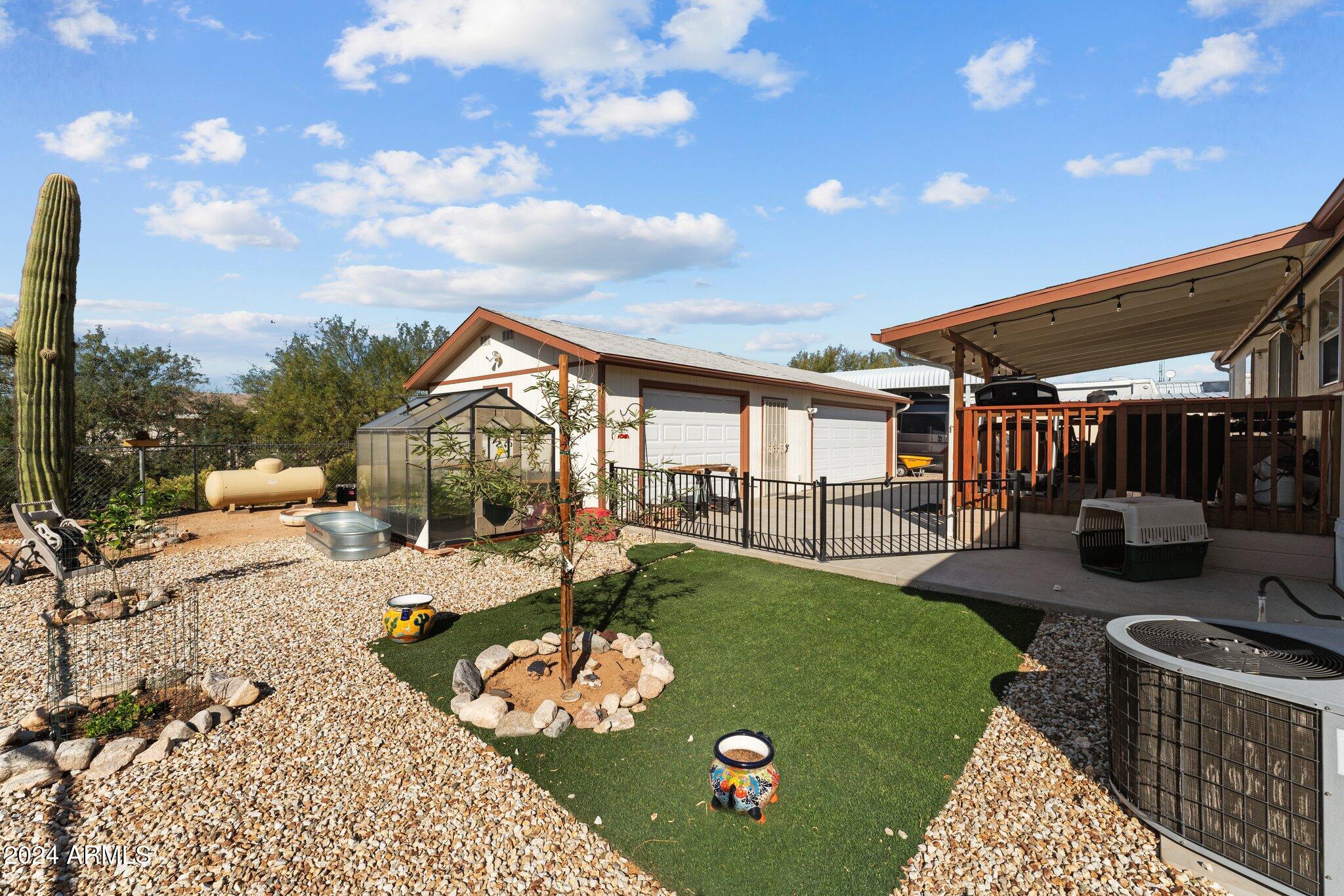 30854 Wandering Way Congress, AZ 85332 - Photo 29 of 43 a view of a backyard with sitting area