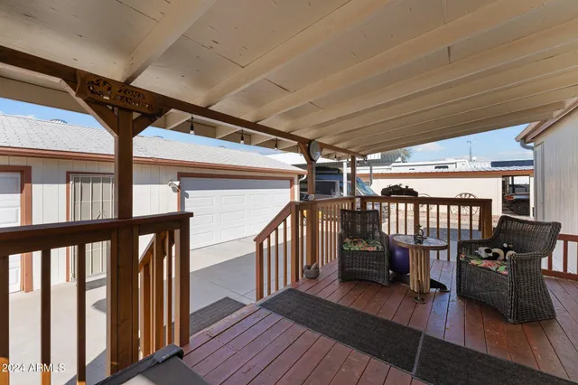 a view of a balcony with furniture