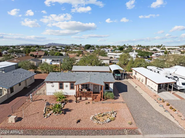 an aerial view of a house with a big yard