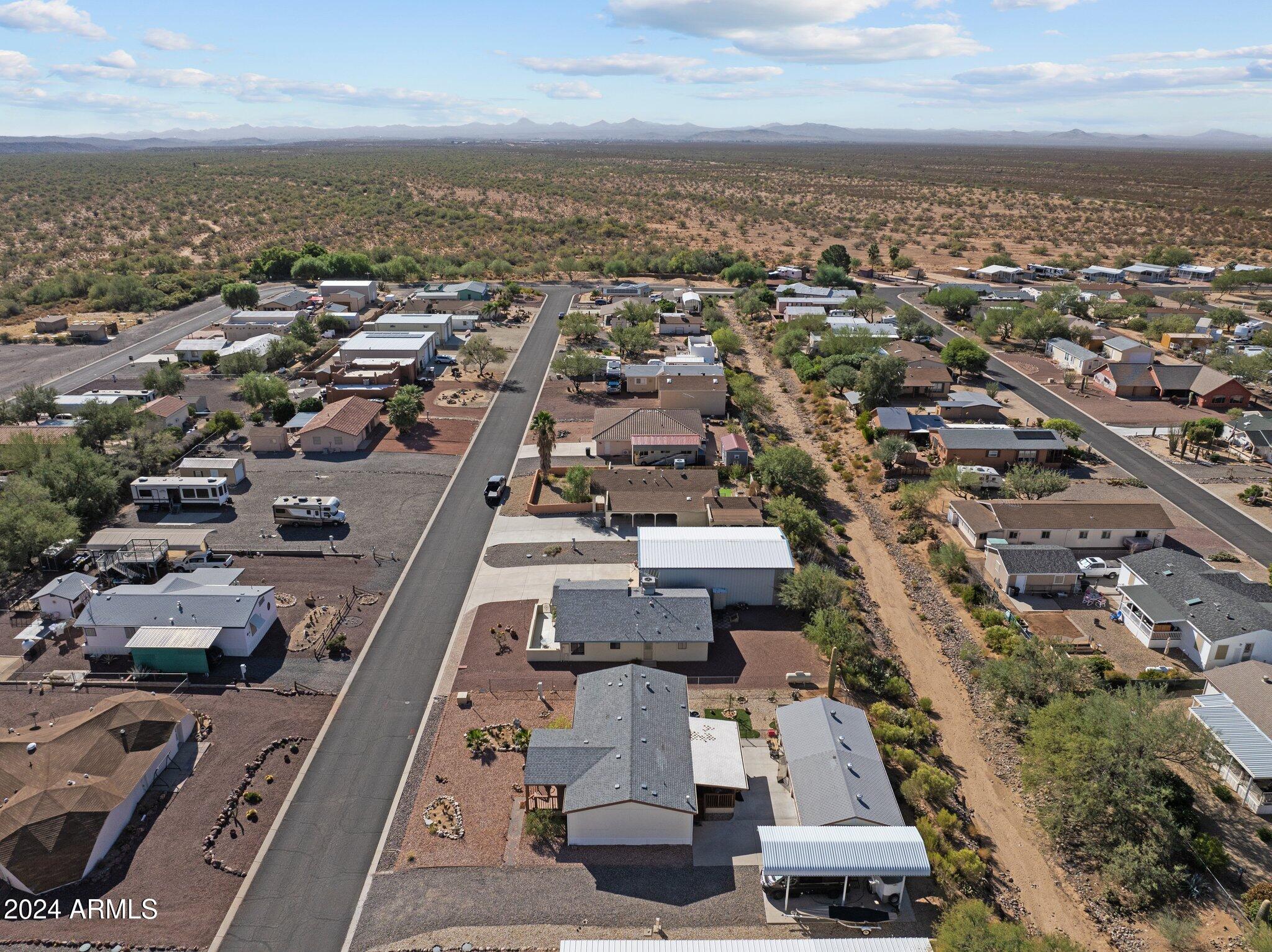 30854 Wandering Way Congress, AZ 85332 - Photo 41 of 43 an aerial view of a city with lots of residential buildings