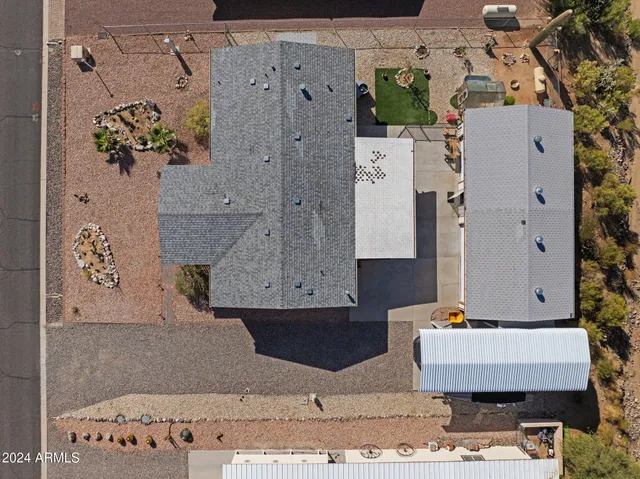 an aerial view of a house with a garden and entryway